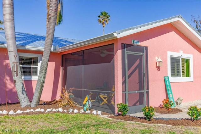 view of home's exterior featuring a sunroom