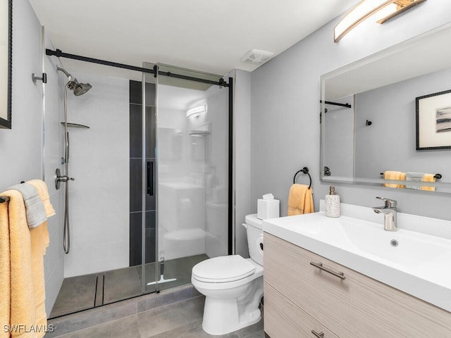 bathroom featuring an enclosed shower, vanity, and toilet