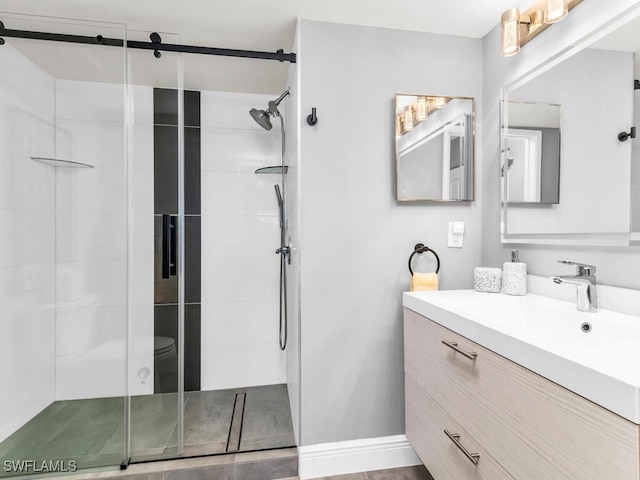 bathroom featuring vanity and an enclosed shower