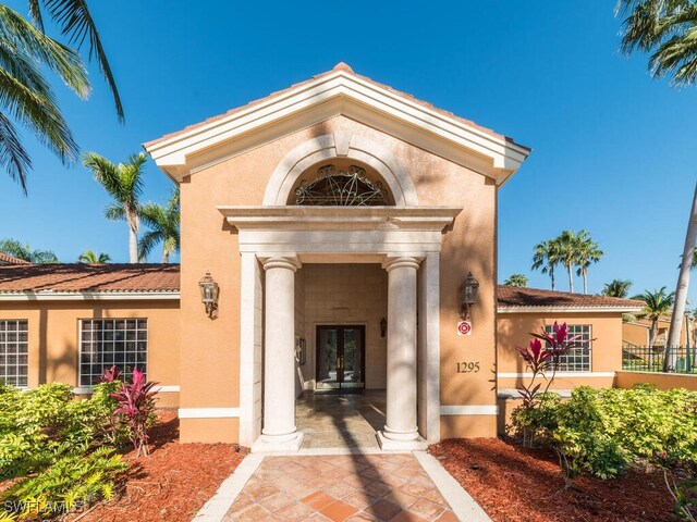 entrance to property featuring french doors