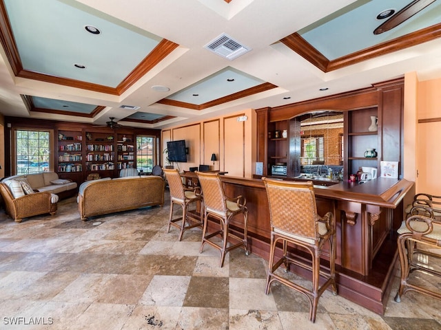 kitchen featuring ornamental molding and coffered ceiling