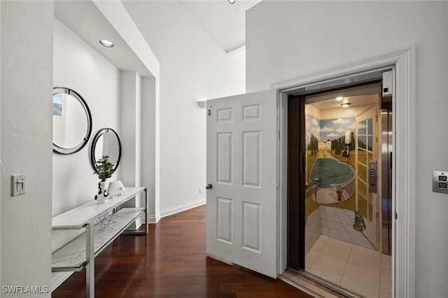 corridor featuring dark wood-type flooring