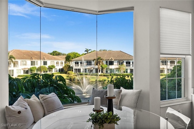 sunroom / solarium with a residential view