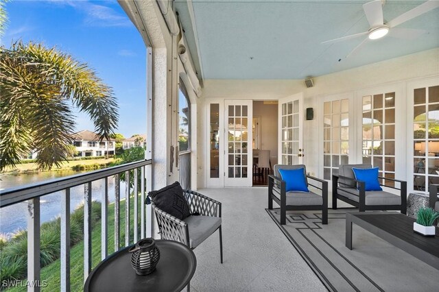 balcony featuring french doors and ceiling fan