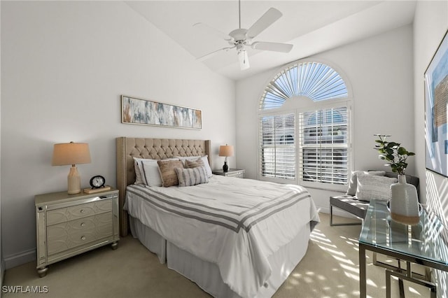 carpeted bedroom featuring ceiling fan and lofted ceiling