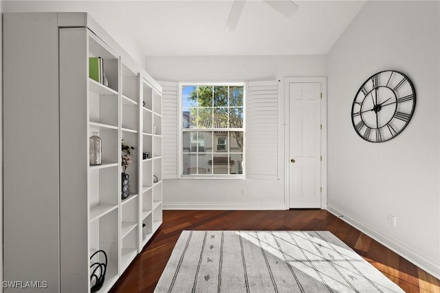 unfurnished room featuring ceiling fan and dark hardwood / wood-style flooring