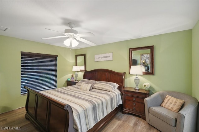 bedroom featuring ceiling fan and light hardwood / wood-style flooring