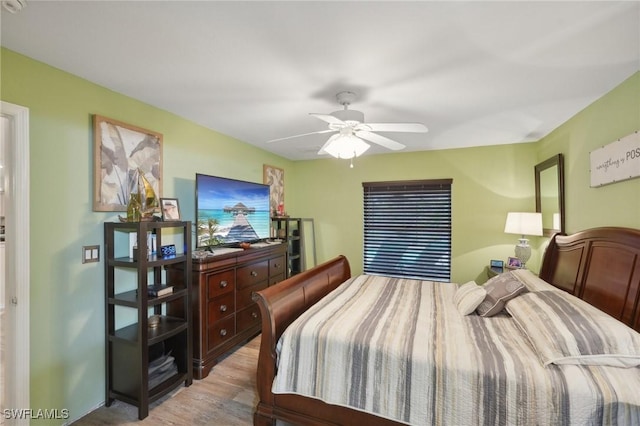 bedroom with ceiling fan and light wood-type flooring