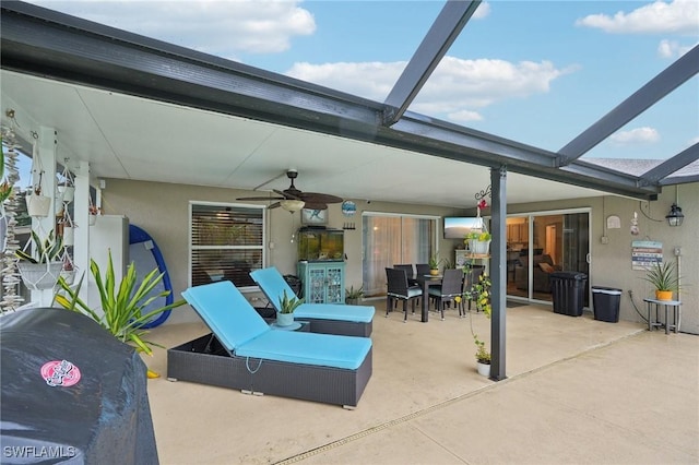 view of patio / terrace with glass enclosure and ceiling fan