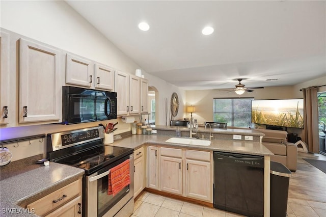 kitchen featuring lofted ceiling, black appliances, sink, light hardwood / wood-style floors, and kitchen peninsula