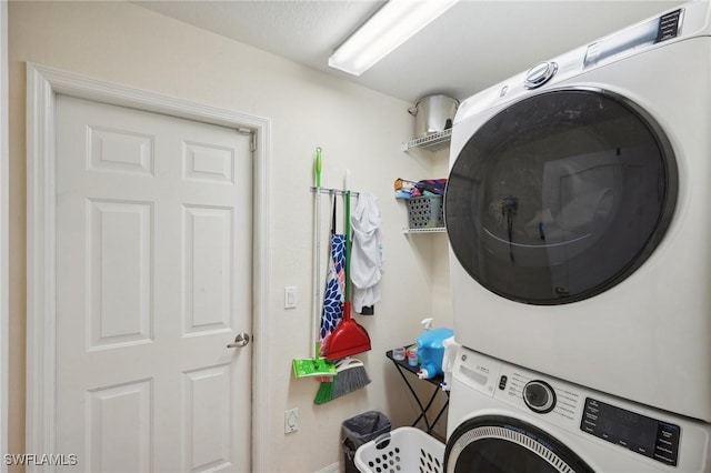 laundry room featuring stacked washing maching and dryer