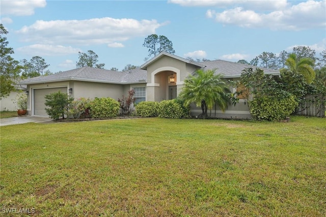 view of front of property with a front yard and a garage