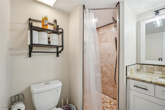 bathroom with a shower with curtain, vanity, and toilet