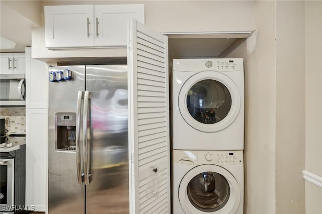 laundry area featuring stacked washer and dryer