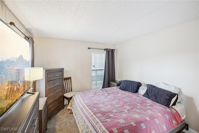 carpeted bedroom with a textured ceiling