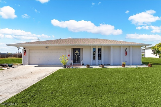 single story home featuring a garage and a front yard