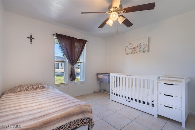 bedroom featuring ceiling fan and light tile patterned flooring