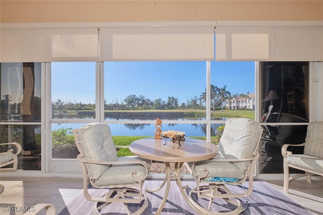 sunroom with a water view