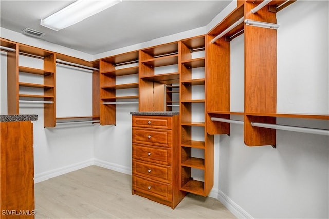 walk in closet featuring light wood-type flooring