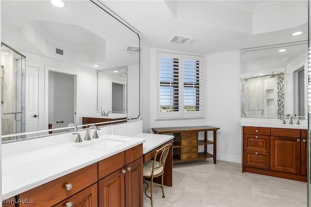 bathroom featuring tile patterned floors, vanity, a raised ceiling, and walk in shower