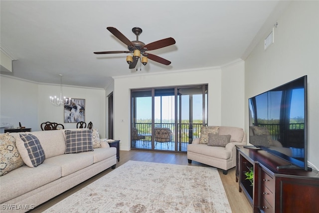 14300 Riva Del Lago Dr Unit 805, Fort Myers, FL 33907 - living room featuring ornamental molding, ceiling fan with notable chandelier, and light wood-style flooring