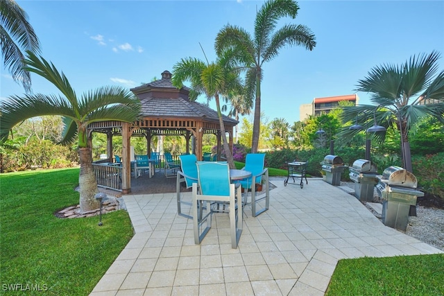 14300 Riva Del Lago Dr Unit 805, Fort Myers, FL 33907 - view of patio with area for grilling, a gazebo, and outdoor dining area