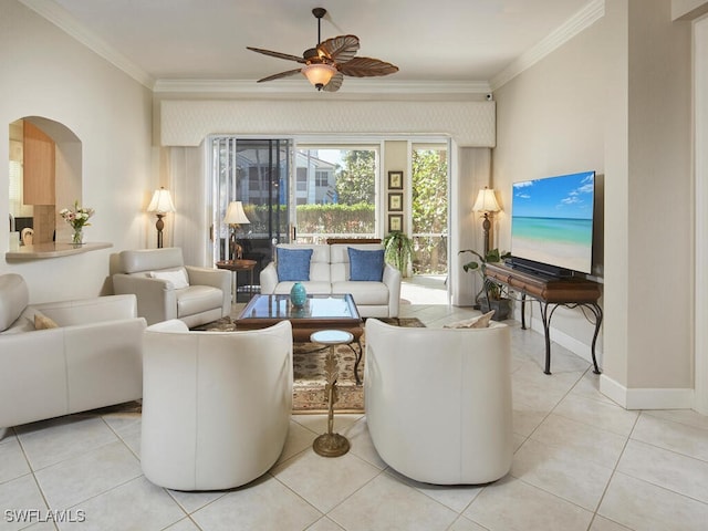 tiled living room featuring ceiling fan and ornamental molding