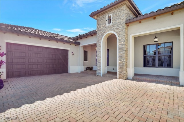 mediterranean / spanish-style house featuring a garage