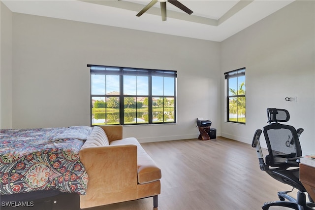 bedroom with ceiling fan and light hardwood / wood-style floors