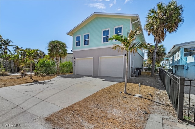 view of side of property featuring a garage