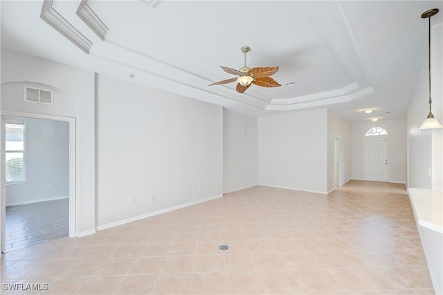 unfurnished room with a tray ceiling and ceiling fan