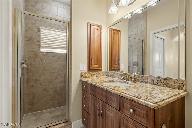 bathroom with vanity and an enclosed shower