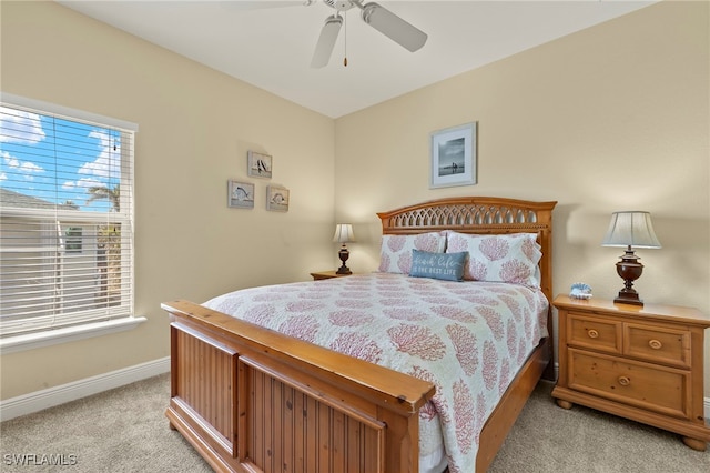 241 Pearl St, Fort Myers Beach, FL 33931 - bedroom with a ceiling fan, light colored carpet, and baseboards