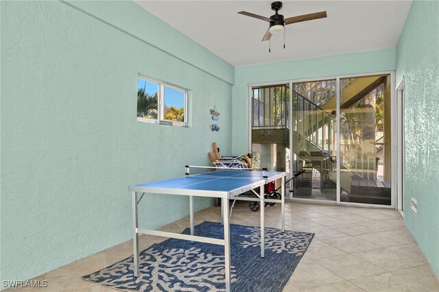 game room featuring ceiling fan and light tile patterned flooring