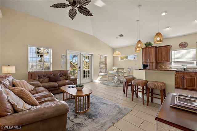 241 Pearl St, Fort Myers Beach, FL 33931 - living room featuring light tile patterned flooring, visible vents, high vaulted ceiling, and a ceiling fan