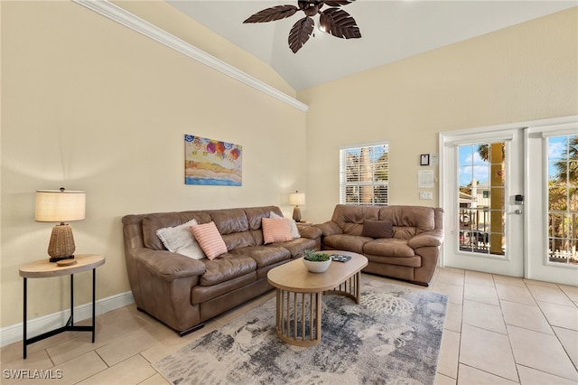 241 Pearl St, Fort Myers Beach, FL 33931 - living area featuring light tile patterned floors, a healthy amount of sunlight, a ceiling fan, and vaulted ceiling