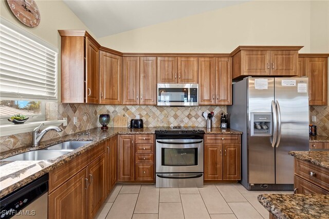 241 Pearl St, Fort Myers Beach, FL 33931 - kitchen with brown cabinets, appliances with stainless steel finishes, and a sink