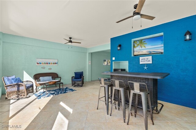 interior space featuring ceiling fan and light tile patterned flooring