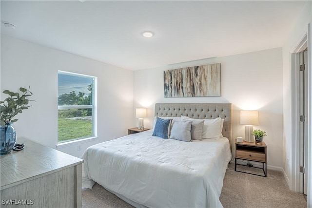 bedroom with light colored carpet