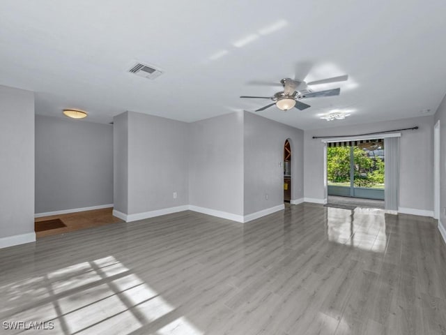 unfurnished room featuring ceiling fan and light wood-type flooring