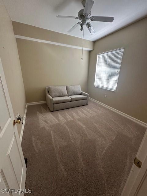 unfurnished room featuring carpet and ceiling fan