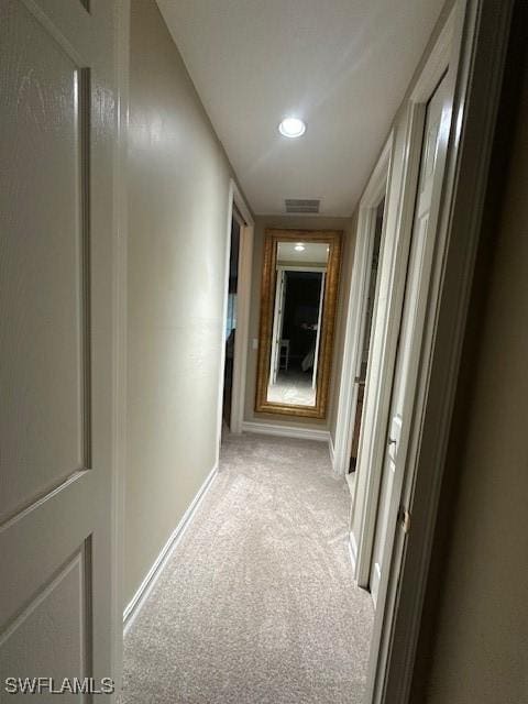 corridor with light colored carpet