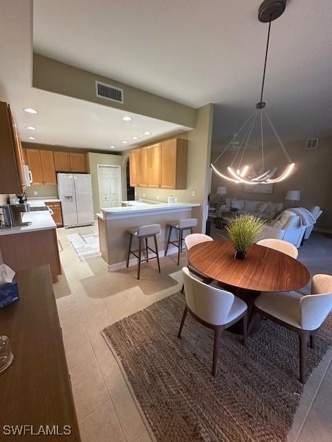 dining room featuring light tile patterned flooring