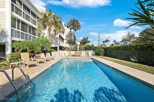 view of swimming pool with a patio area