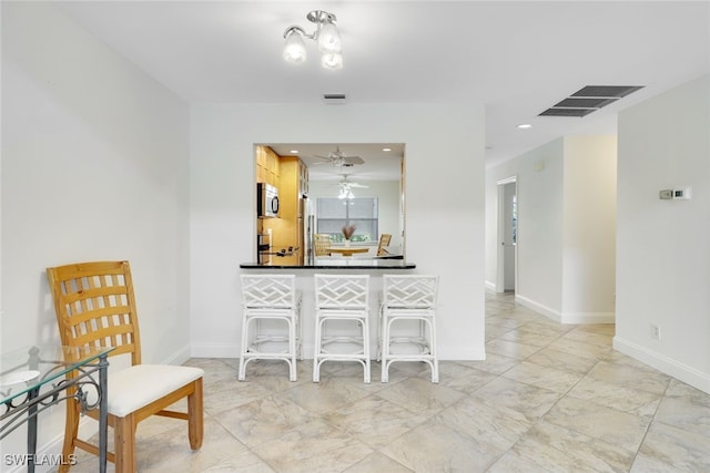 dining space featuring ceiling fan