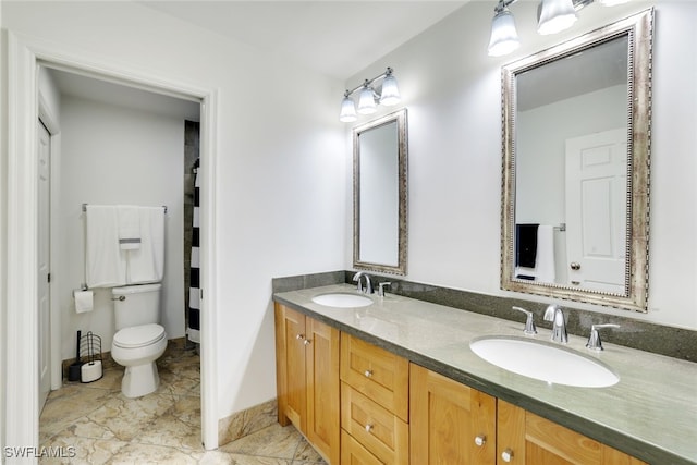 bathroom with vanity and toilet