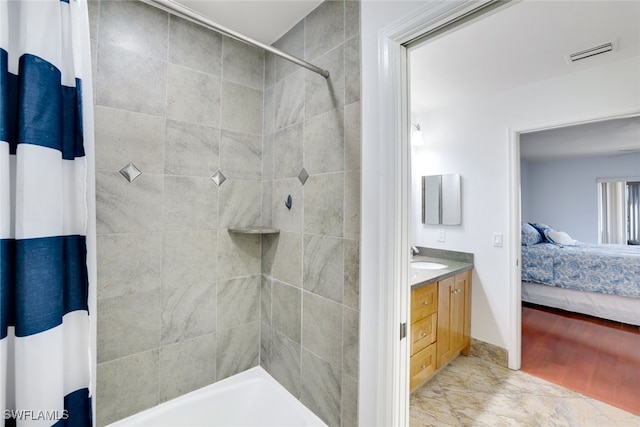 bathroom featuring hardwood / wood-style floors and vanity