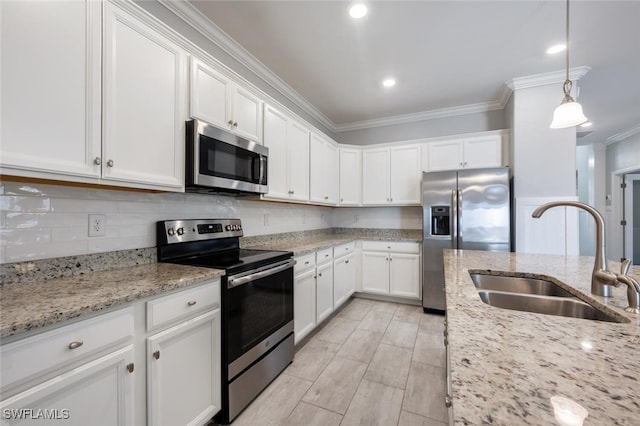 kitchen featuring white cabinetry, appliances with stainless steel finishes, and a sink