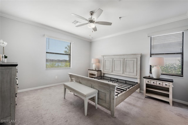 bedroom with light carpet, multiple windows, baseboards, and ornamental molding