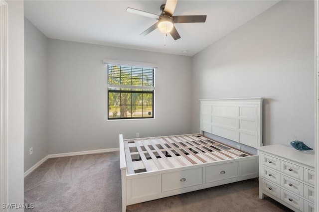 unfurnished bedroom featuring carpet, baseboards, and ceiling fan